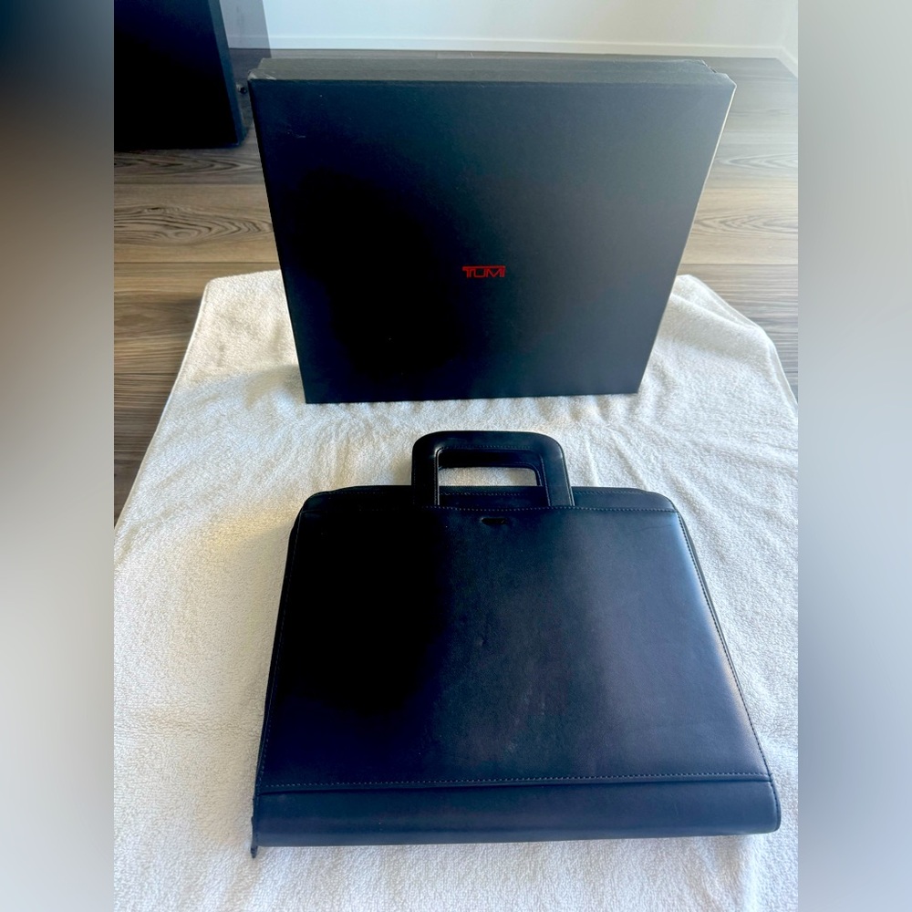 Tumi Portfolio with retractable handles
including original box